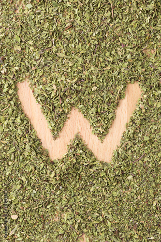 Photo: Letter W written with oregano Letter W written with oregano