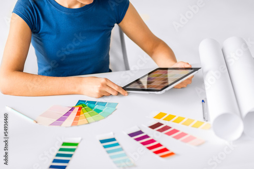 Photo: woman working with color samples for selection woman working with color samples for selection