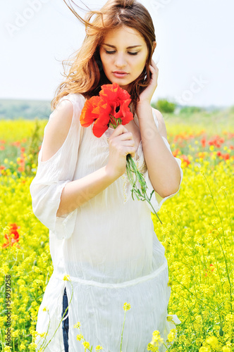 Photo: beautiful girl in rapeseed field beautiful girl in rapeseed field
