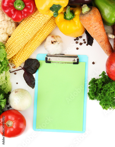 Photo: Fresh vegetables and spices and paper for notes, isolated Fresh vegetables and spices and paper for notes, isolated