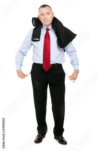 Photo: Sad and broke business man with empty pockets Sad and broke business man with empty pockets