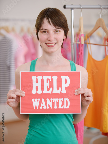 Photo: Job offer: Woman with Help Wanted sign Job offer: Woman with Help Wanted sign