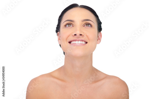 Photo: Smiling natural model posing looking up Smiling natural model posing looking up