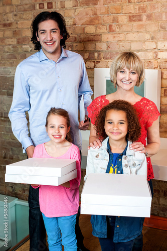 Photo: Excited little girls holding pizza boxes Excited little girls holding pizza boxes