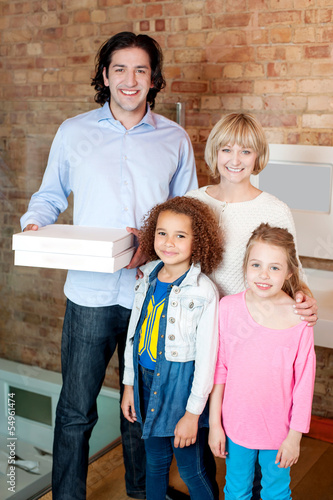 Photo: Little girls with parents posing casually Little girls with parents posing casually