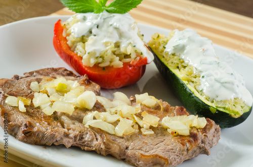 Photo: Beef steak with fried onion and stuffed vegetables Beef steak with fried onion and stuffed vegetables