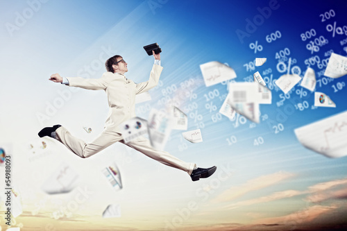 Photo: Image of jumping businessman Image of jumping businessman