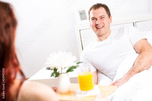 Photo: woman brought her boyfriend breakfast in bed woman brought her boyfriend breakfast in bed