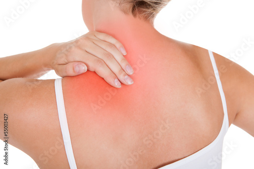 Photo: Woman having back pain Woman having back pain
