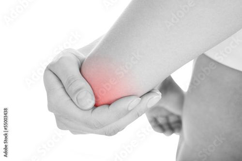 Photo: Woman with elbow pain Woman with elbow pain