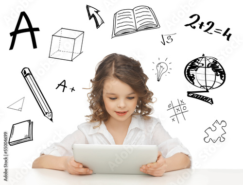 Photo: student girl playing with tablet pc student girl playing with tablet pc