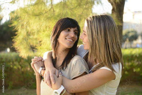 Photo: lesbian couple hugging lesbian couple hugging