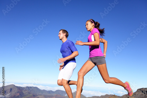 Photo: Running people - Runners training outdoor Running people - Runners training outdoor