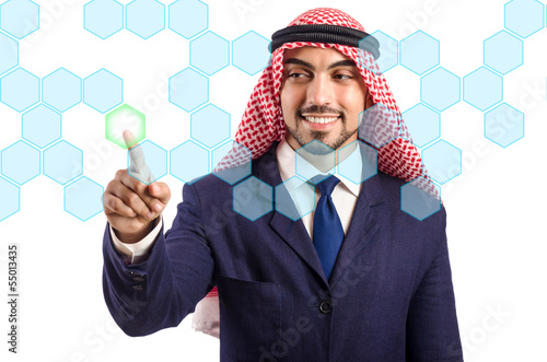 Photo: Arab man pressing virtual buttons Arab man pressing virtual buttons