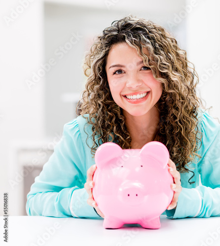 Photo: Woman saving money Woman saving money