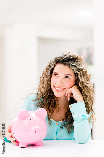 Photo: Thoughtful woman with her savings Thoughtful woman with her savings