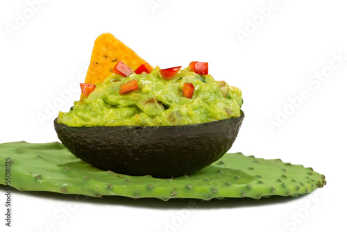 Photo: Guacamole on green cactus leaf. Guacamole on green cactus leaf.