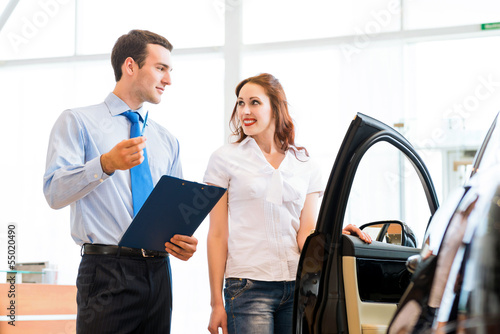 Photo: Consultant in the showroom and the buyer Consultant in the showroom and the buyer