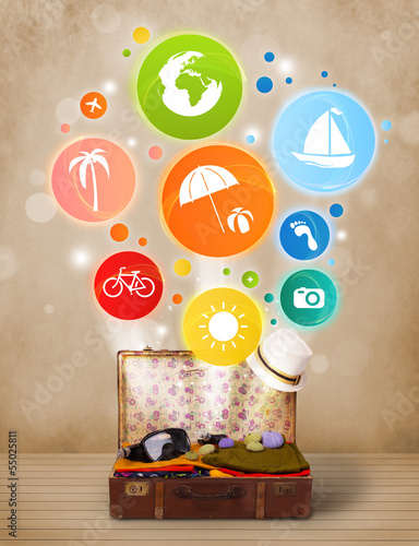 Photo: Suitcase with colorful summer icons and symbols Suitcase with colorful summer icons and symbols