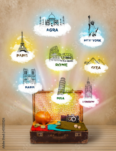 Photo: Tourist suitcase with famous landmarks around the world Tourist suitcase with famous landmarks around the world