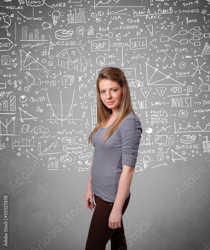 Photo: Young pretty lady with hand drawn calculations and icons Young pretty lady with hand drawn calculations and icons