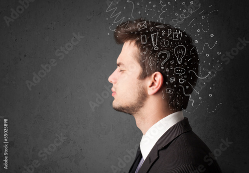 Photo: Young man thinking with abstract lines and symbols Young man thinking with abstract lines and symbols