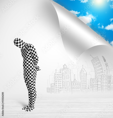 Photo: Man in body suit escaping from city to nature concept Man in body suit escaping from city to nature concept