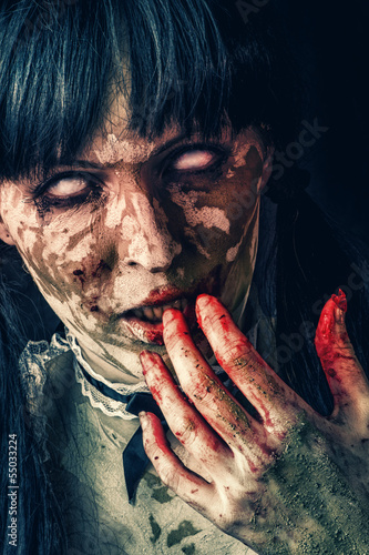 Photo: Scary zombie woman with bloody eyes Scary zombie woman with bloody eyes