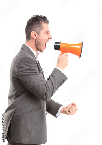 Photo: Young man shouting through megaphone Young man shouting through megaphone
