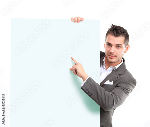 Photo: Happy business man presenting and showing Happy business man presenting and showing
