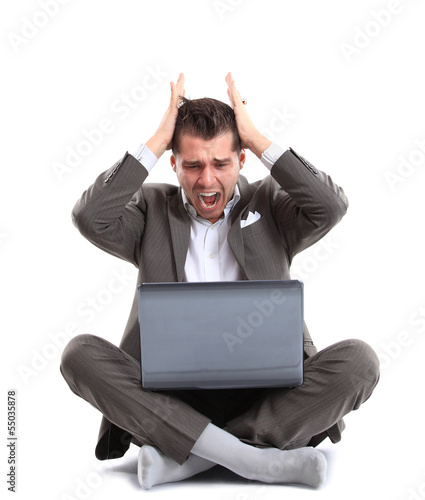 Photo: Man shouting at laptop Man shouting at laptop