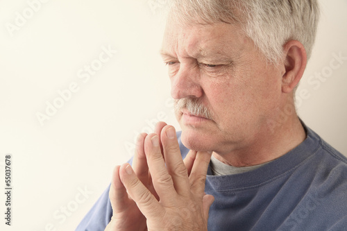 Photo: senior man is lost in thought senior man is lost in thought