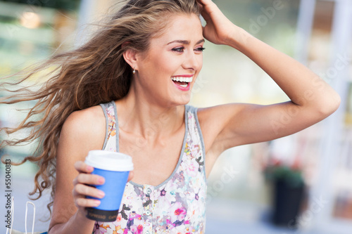 Photo: Woman outdoors with coffee Woman outdoors with coffee