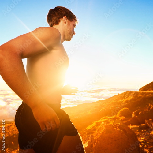 Photo: Running people - male runner at sunset in mountain Running people - male runner at sunset in mountain