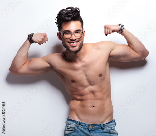 Photo: topless young man showing off with biceps topless young man showing off with biceps