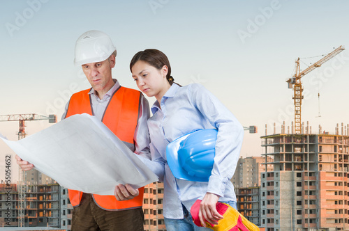 Photo: Foreman and engineer with blueprints Foreman and engineer with blueprints