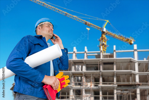 Photo: Foreman with blueprints Foreman with blueprints