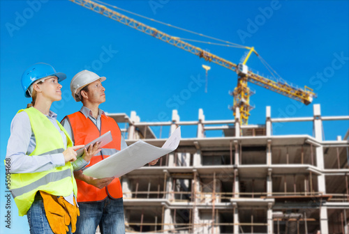 Photo: Foreman and engineer with blueprints Foreman and engineer with blueprints