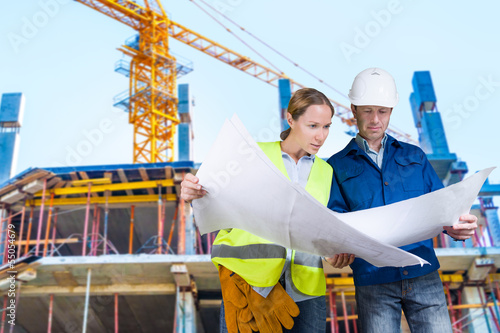 Photo: Foreman and engineer with blueprints Foreman and engineer with blueprints