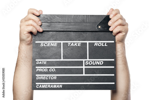 Photo: two male hands holding movie production clapper board isolated o two male hands holding movie production clapper board isolated o