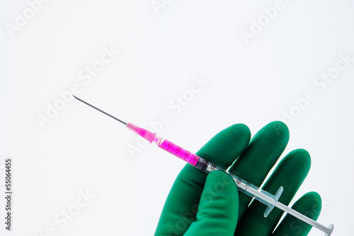 Photo: Spritze Hand Handschuh spritzen Medizin Spritze Hand Handschuh spritzen Medizin