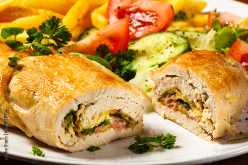 Photo: Fried wrapped meat, French fries and vegetables Fried wrapped meat, French fries and vegetables