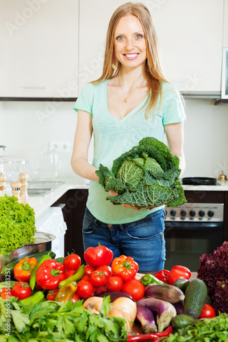 Photo: happy beautiful woman with raw vegetables happy beautiful woman with raw vegetables