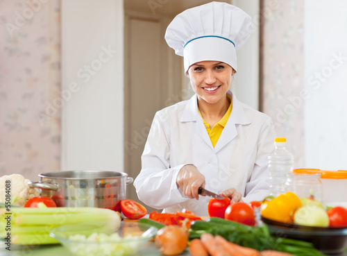 Photo: cook works with vegetables at kitchen cook works with vegetables at kitchen