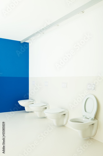 Photo: new architecture, public bathroom, toilets in a row new architecture, public bathroom, toilets in a row
