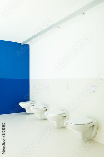 Photo: new architecture, public bathroom, toilets in a row new architecture, public bathroom, toilets in a row