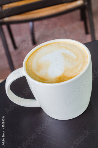 Photo: Latte on the black table Latte on the black table
