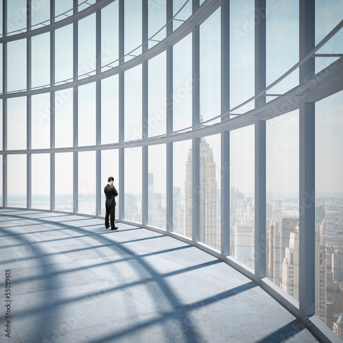 Photo: businessman looking at city businessman looking at city