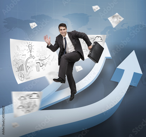 Photo: Businessman jumping over arrows Businessman jumping over arrows