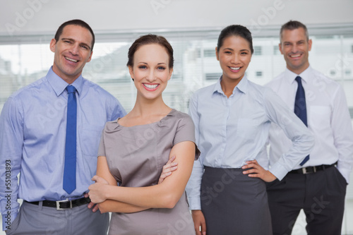Photo: Cheerful work team posing together Cheerful work team posing together